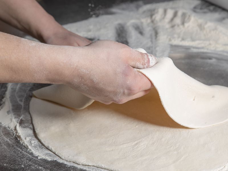 Giordanos deep dish pizza being prepared in our Chicago kitchen